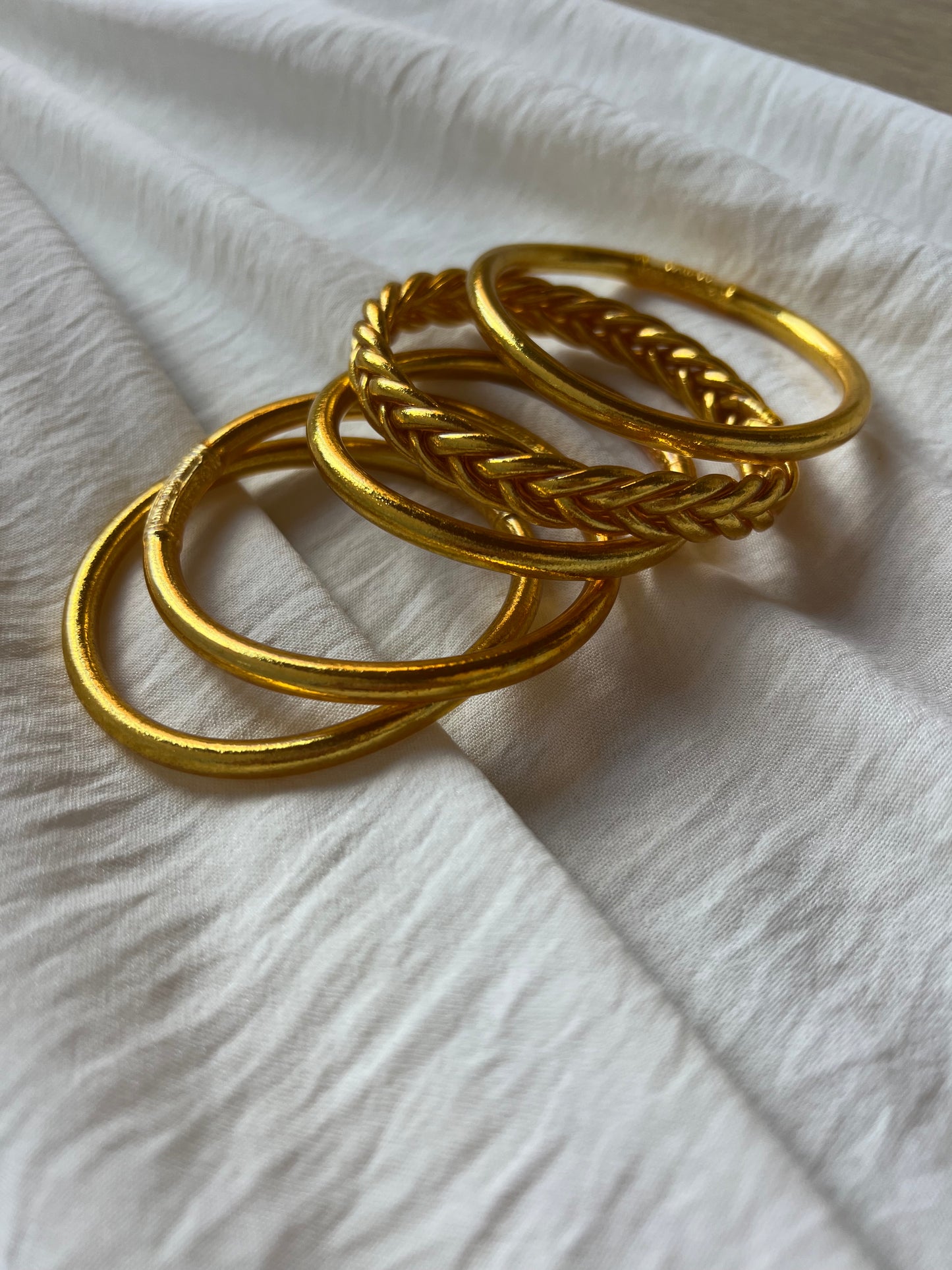 Pack of 4 Gold Leaf Bracelets and 1 Braided Gold Bracelet